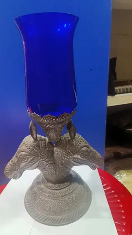 Decorative blue glass vase on ornate metal stand- 22x36cm