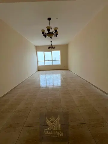 A luxurious two-bedroom apartment with a living room is available for rent in the Al Taawun area of Sharjah. Located in a distinctive tower, the pro