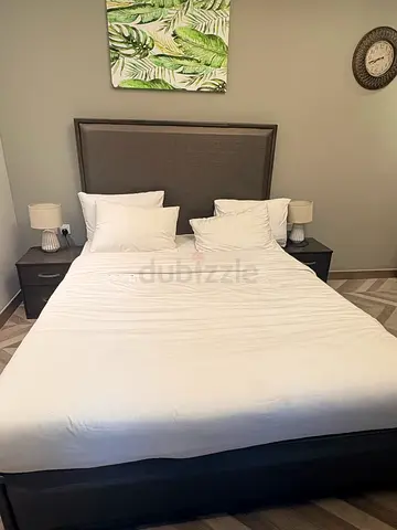 Queen bed frame with upholstered headboard and matress - good condition