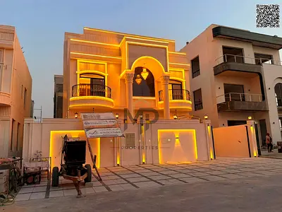 Luxury classic villa for sale in Al Helio 2 – Ajman | Full stone facade | Strategic location directly opposite Azhi Complex | Elegant design and luxur