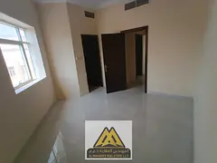 One-bedroom apartment for annual rent in Al Alia, Ajman. New building, 2 bathrooms, central AC, near