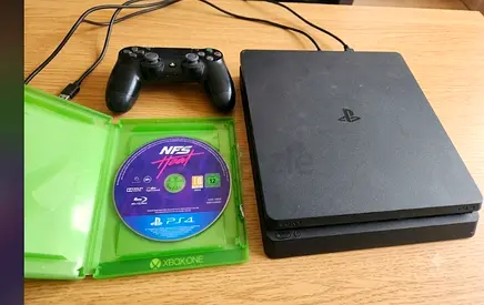 Playstation 4 Slim (1 Terabyte) with original controller and NFS game