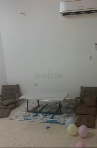 Low glass coffee table with metal frame with modern rug - marble imitation