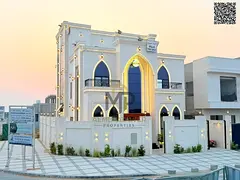 New corner villa with a full stone facade and central air conditioning in a prestigious residential