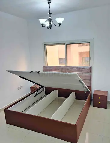 Queen storage bed with hydraulic lift and 2 bedside tables