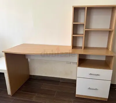 Light wood study desk with shelving and two drawers