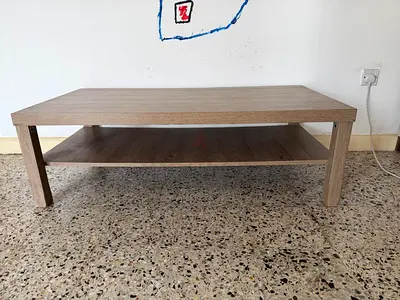 Simple light-wood coffee table with lower shelf - good condition