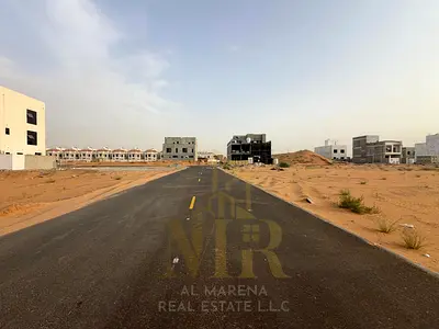 Townhouse land for sale in Al Zahia Square – Ajman | Two adjacent plots | Paved road | Freehold | Permit G+2 | Area 160 m² ≈ 1,722 ft² per plot | AED