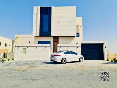 Villa for sale in Al Bahia, Ajman. The price includes registration, ownership, electricity, and wat