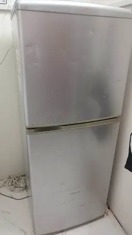 The best deal...Silver double-door refrigerator, good working condition
