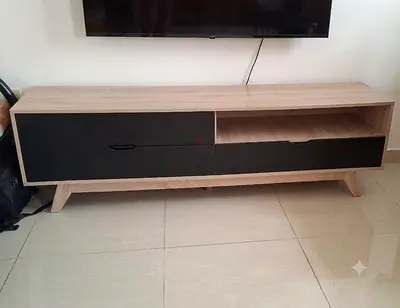 Modern wooden TV cabinet with storage drawers and open shelf
