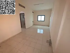 For annual rent: Two-bedroom apartment with a living room and two bathrooms, located on the Ajman Co