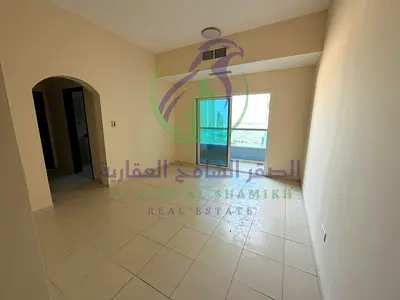 One bedroom apartment with a living room for annual rent in Al Mamzar Sharjah Balcony overlooking Al Khan Corniche Spacious layout Modern finishes Pri