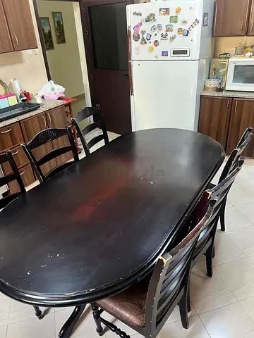 Solid dark wood 6-seater dining table with chairs