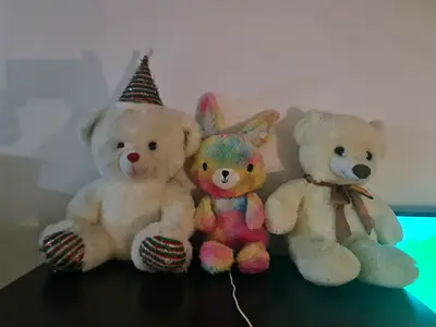Three plush stuffed animals - 2 white bears and a rainbow bunny