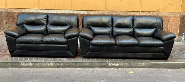 Black leather 3-seater and 2-seater sofa set — good condition