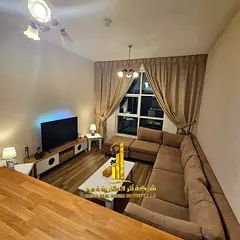 Luxury one-bedroom apartment with a living room and open balcony. Ajman City Tower. Fully furnished,