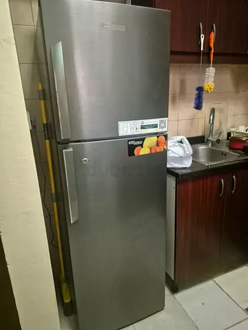 Stainless steel double-door refrigerator - good working condition.  Available end of August.