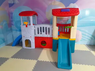 Small plastic indoor playset with slide and climbing tunnel