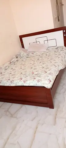 Wooden double bed frame with headboard - good condition