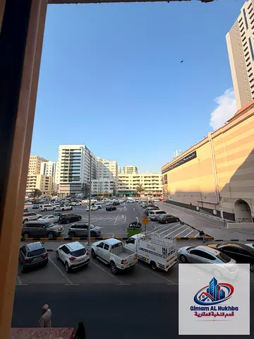1BR in Al Majaz 1 with 2 bathrooms, central AC, practical kitchen, prime location, 15 days free, AED 29,000.