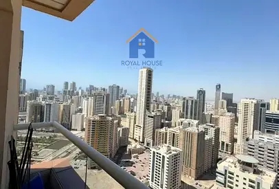 2BR apartment for sale in Al Olya Tower, Al Nahda, 1,400 sqft, private parking. AED 650,000.
