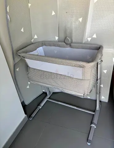 Baby bedside crib with musice device