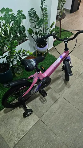 Kids pink balance/learning bicycle with training wheels - good condition