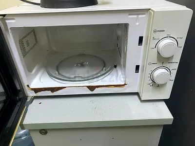 Used Small Microwave Oven - Functional, Some Rust and Stains