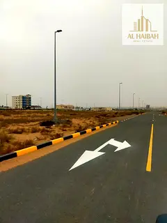 Land for sale in Al Tai Commercial, residential/commercial zone, permit for ground floor + 7 floors,