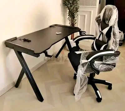 Black gaming/office desk with ergonomic swivel chair - like new