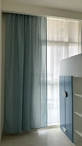 Pair of light-blocking patterned curtains with sheer liners - mint blue
