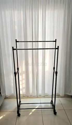 Adjustable Double Rail Clothes Rack on Wheels.  (final price)