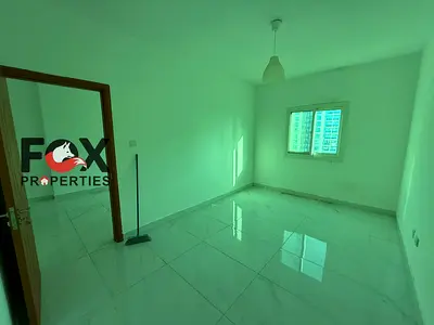 Cheapest 1-bedroom apartment with a living room for annual rent in Ajman, in Al Rashidiya 3 area. One month free, central air conditioning