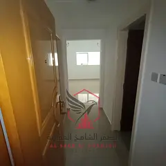 Apartment for annual rent - Al Qasimia. Spacious areas, open view, free maintenance, central air con