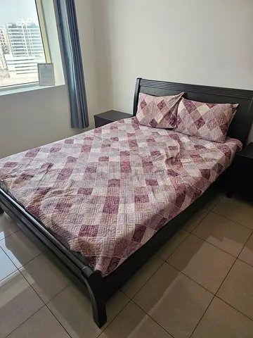 Wooden double bed with mattress, two side tables headboard and dressing table - very good condition.