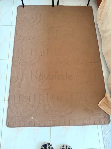 Brown rectangular area rug / carpet - good condition