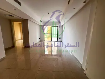 1BR for annual rent in Al Taawun. Master bedroom, living room with balcony, 2 bathrooms, built-in wardrobes, free parking, free gym