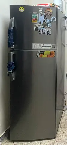 Silver double-door refrigerator, good working condition