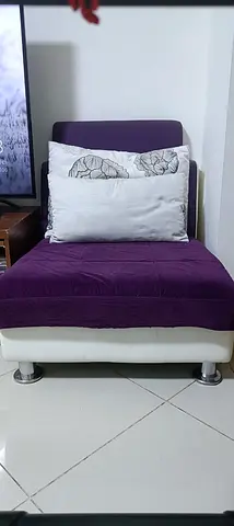 Single purple accent lounge chair with cushions - good condition