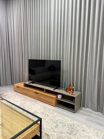 Modern low TV unit with storage - light wood and concrete finish