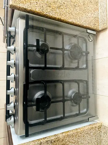 Used 4-Burner Stainless Steel Gas Stove with unused Oven with the accessories .