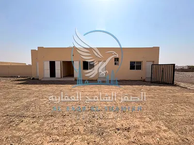 Yard for rent in Al Dhaid, 10,000 sq. ft., divided into two yards of 5,000 sq. ft. each, Suitable for storage and industrial use, 4 cheques