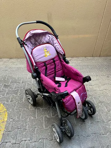 Used pink baby stroller/pram in good working condition