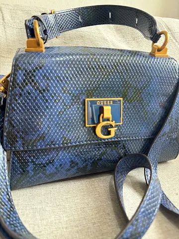 Blue Guess faux-snakeskin crossbody bag with gold hardware