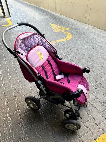 pink baby stroller/pram in perfect working condition