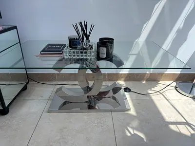 Glass Top Coffee Table with Polished Chrome Sculptural Base