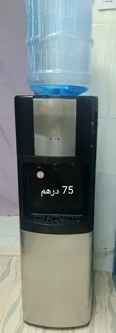 Used stainless steel water cooler dispenser with bottle - working condition
