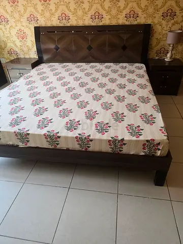 King size wooden bed frame with headboard and matching bedside tables
