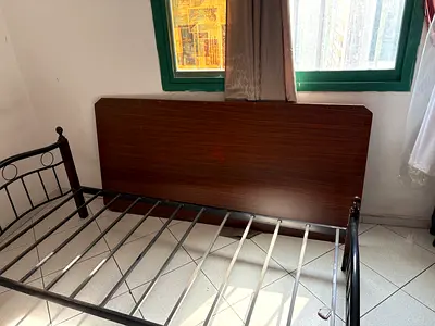 Metal bed frame with wooden headboard - single/king single
